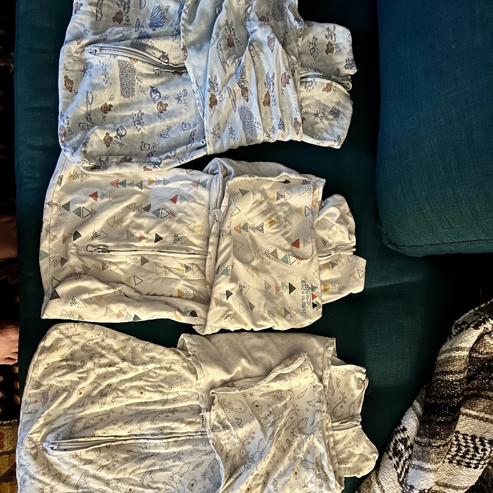 3 cotton Halo sleep sacks in different patterns. For 3-6 months.